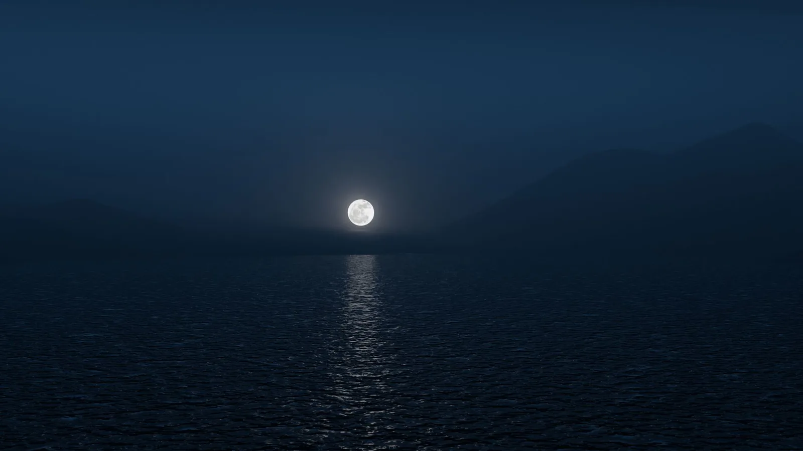Full moon over a calm dark sea at night